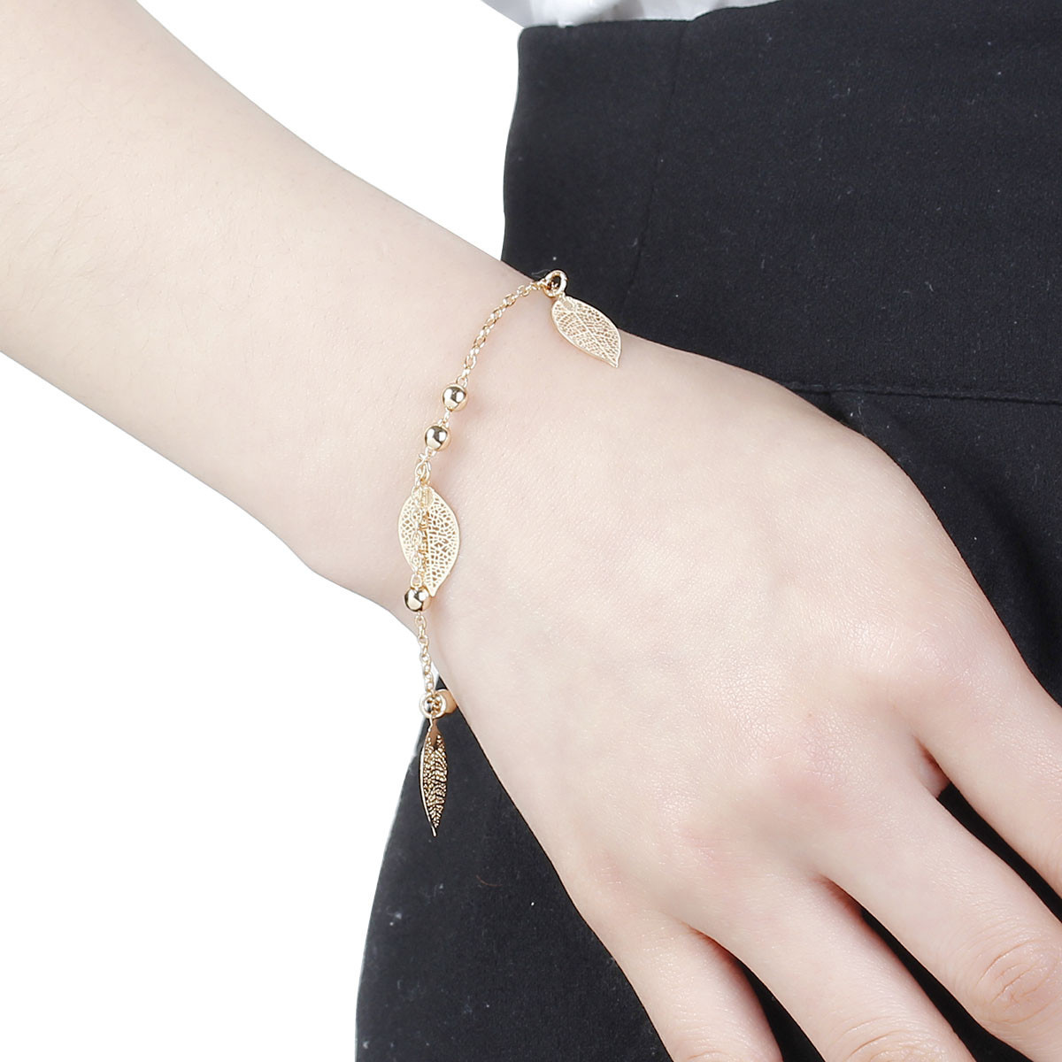 SEXY SPARKLES Filigree Stamping Bell Bracelet Gold Plated Whit Hollow Leaf Pend