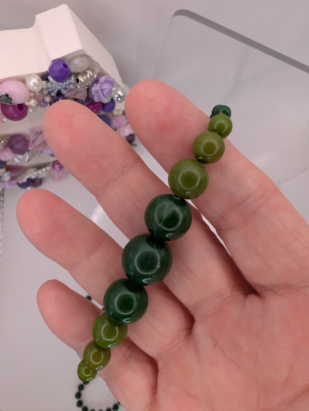Long single strand green prominent graduated focal statement beaded necklace