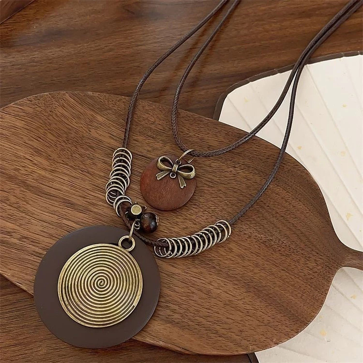 7Pcs Bohemian Women’s Necklace Set – Layered Cord Necklaces with Feather