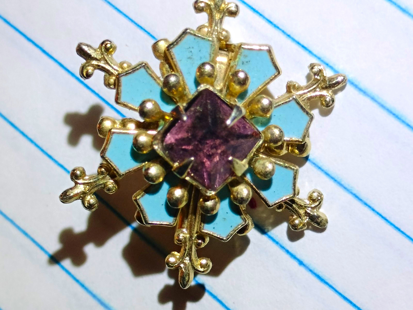 Gold Tone Metal Snowflake Pin Brooch with Blue Enamel & Purple Square Stone