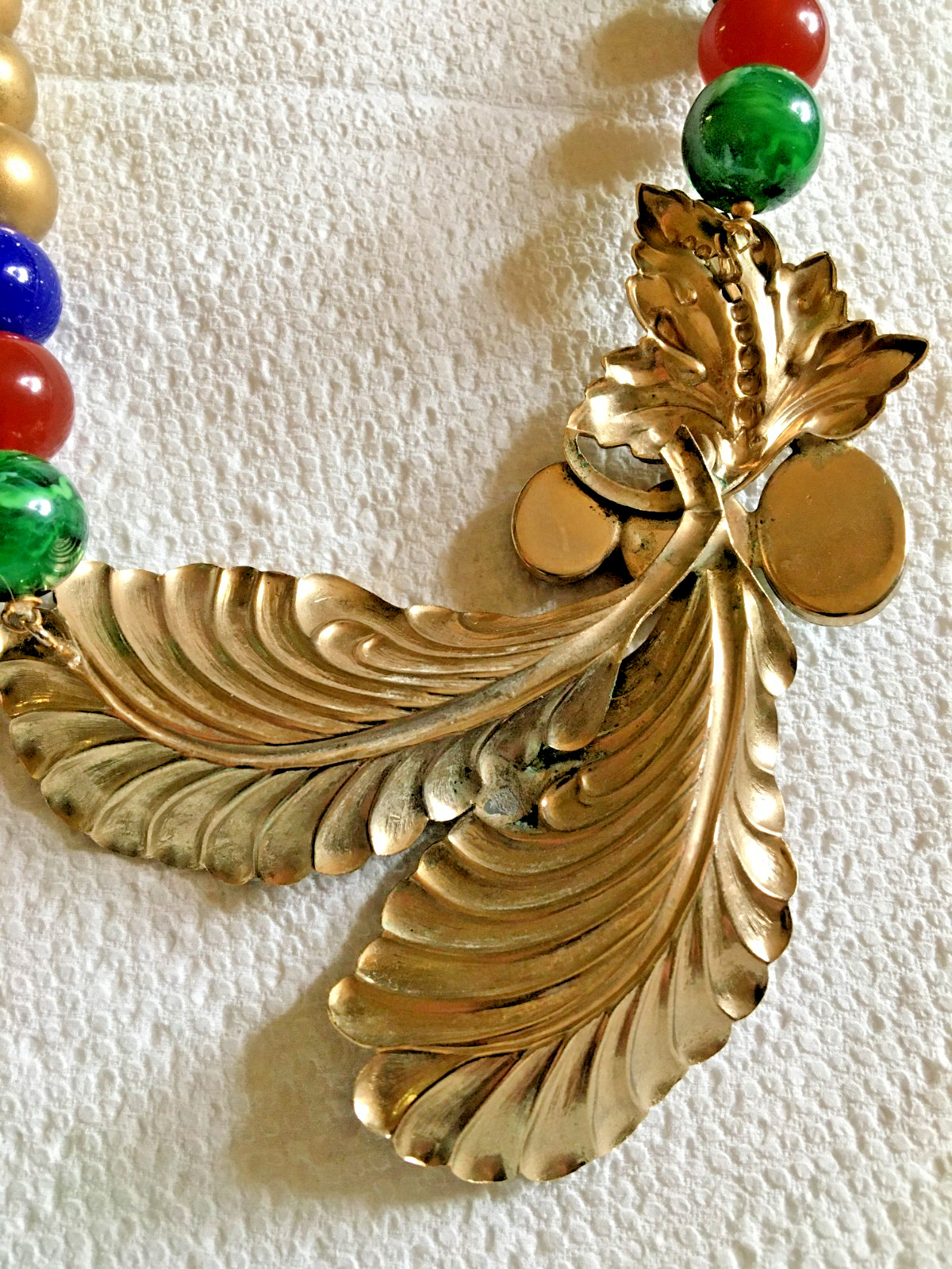 Ornate 18″ Necklace Golden + Stamped Metal Feathers? + Drilled Glass Beads