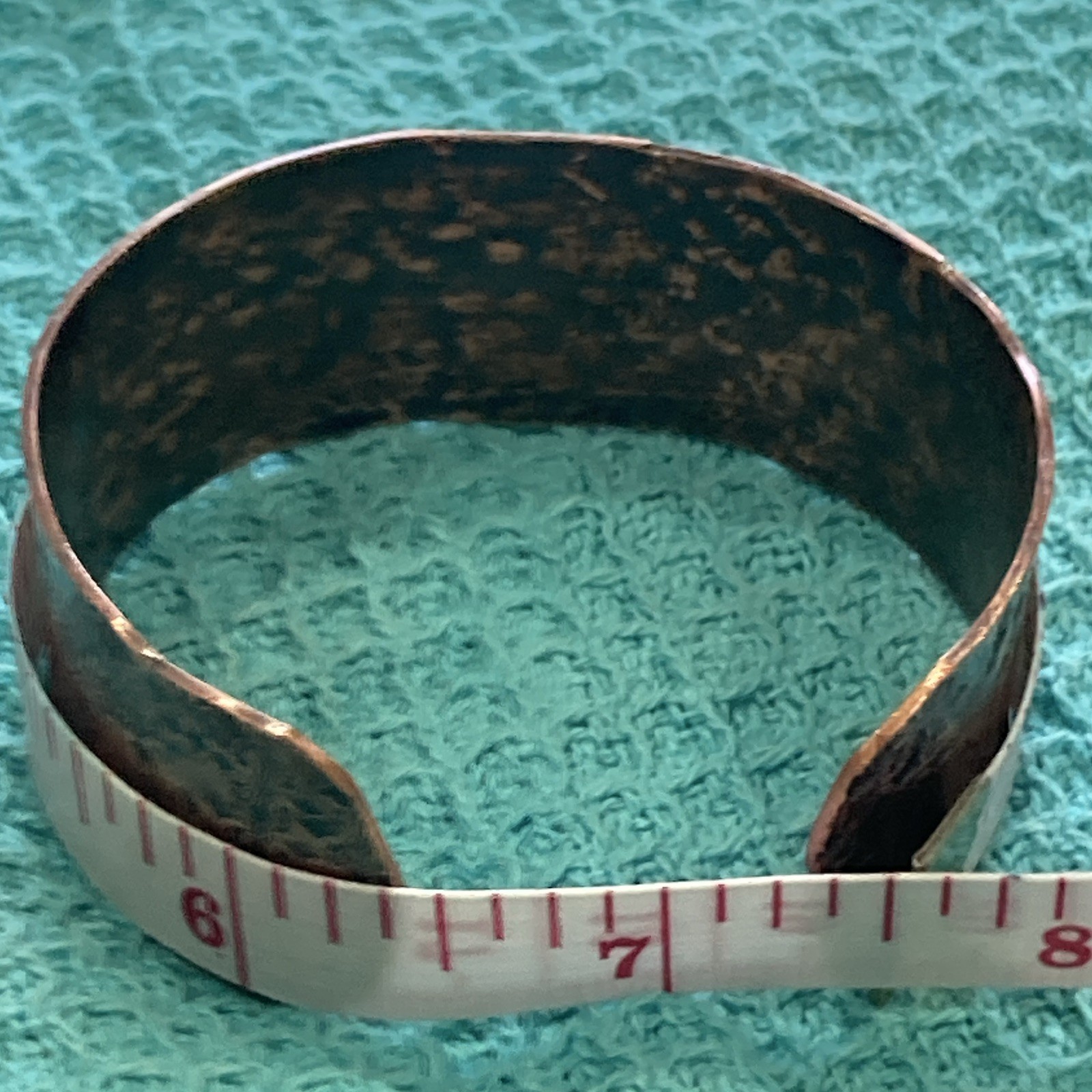 Wide floral embossed copper open-ended cuff bracelet, size 6.5 in, no stone