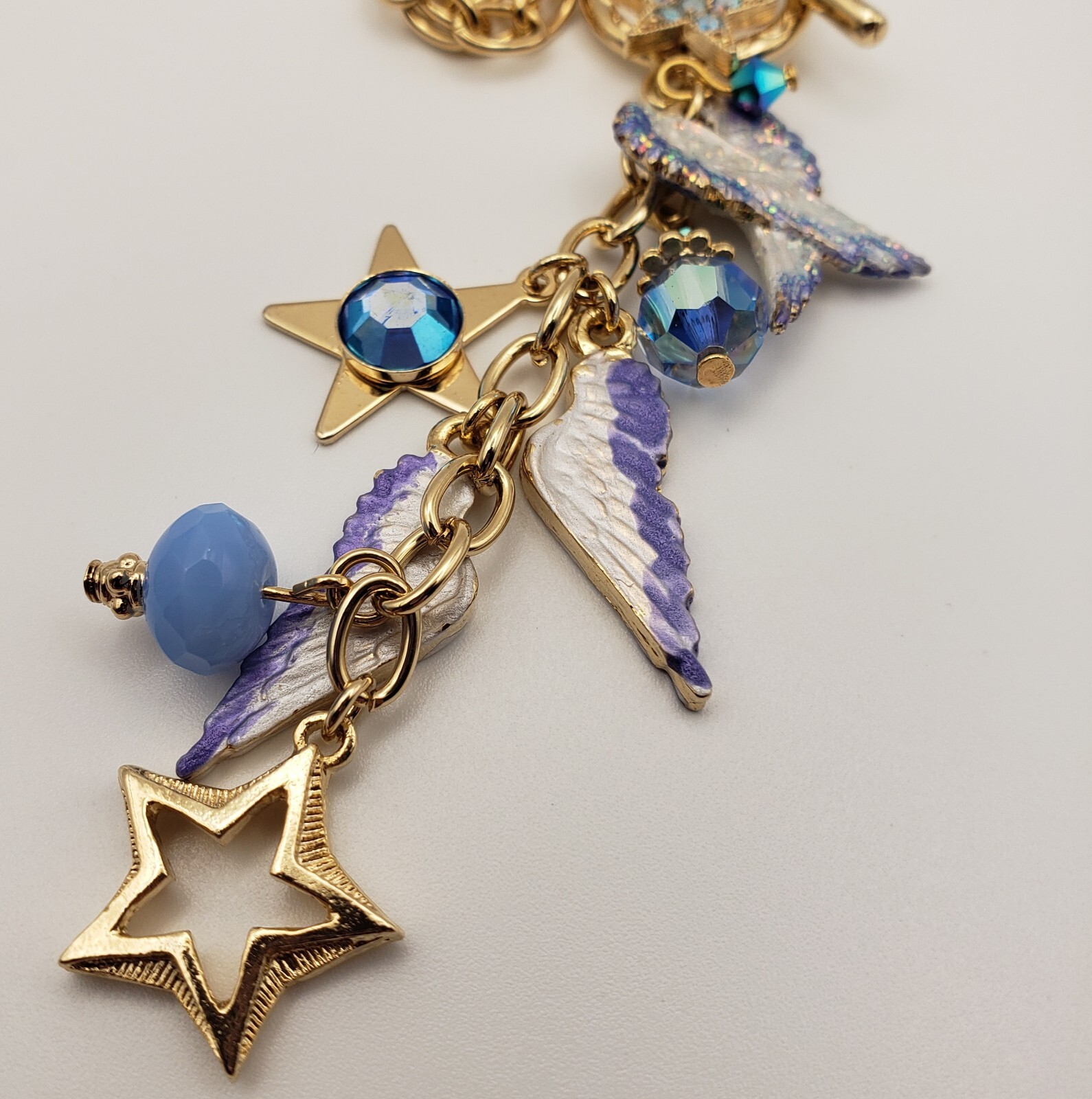 Kirks Folly Forever Angel Wings Charm Necklace Gold Tone 17in Long Blue Crystals