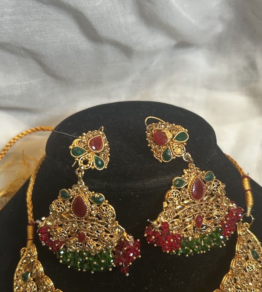 Gold Jewelry Set with Red and Green Details