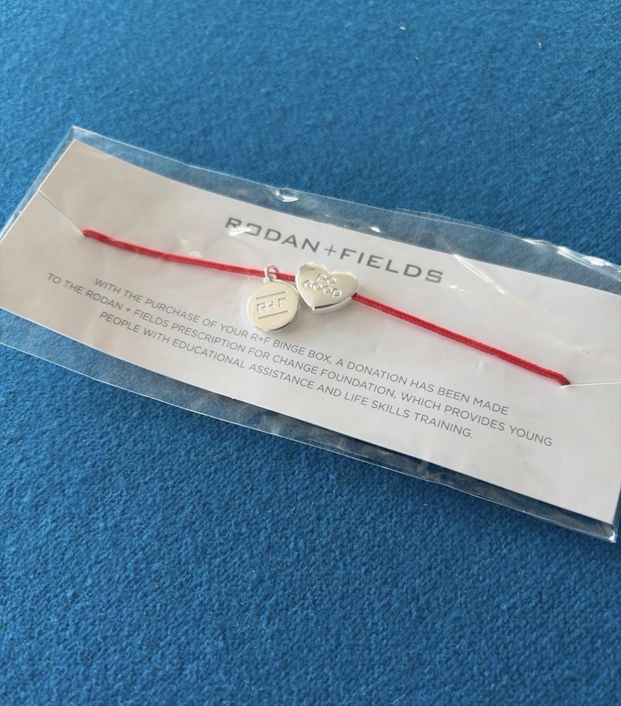 Rodan + Fields “DO GOOD” Silver Charm Red String Bracelet
