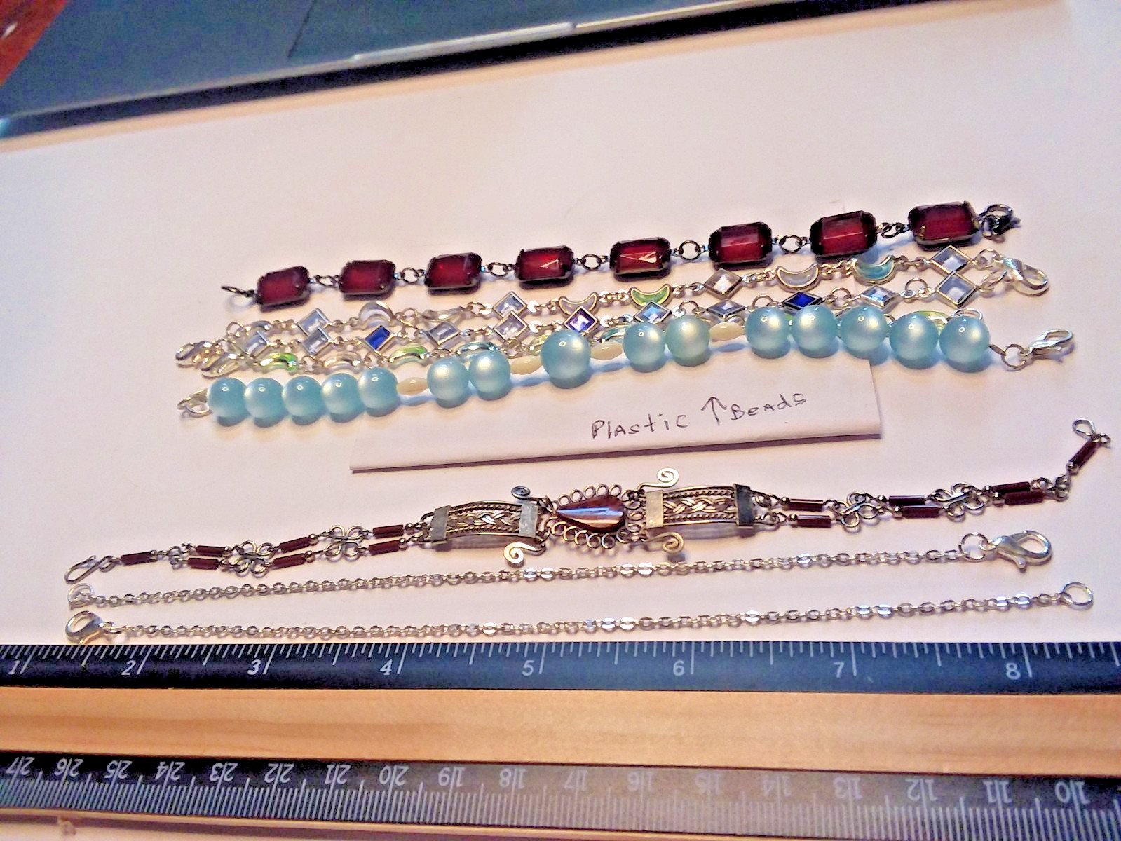 8 Bracelets: 3 Bracelets are Metal, 5 are Plastic 05-01-2026