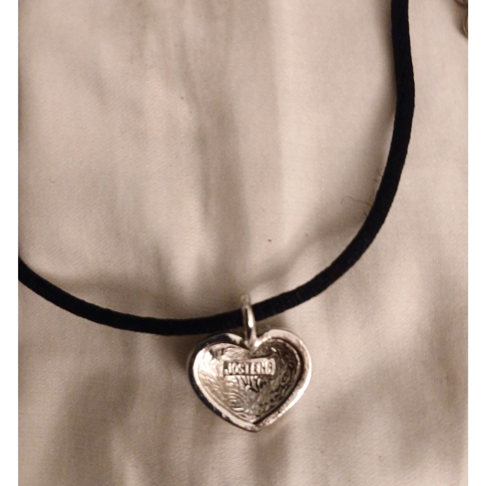 Josten’s silver tone tiny heart pendant rhinestones black cord