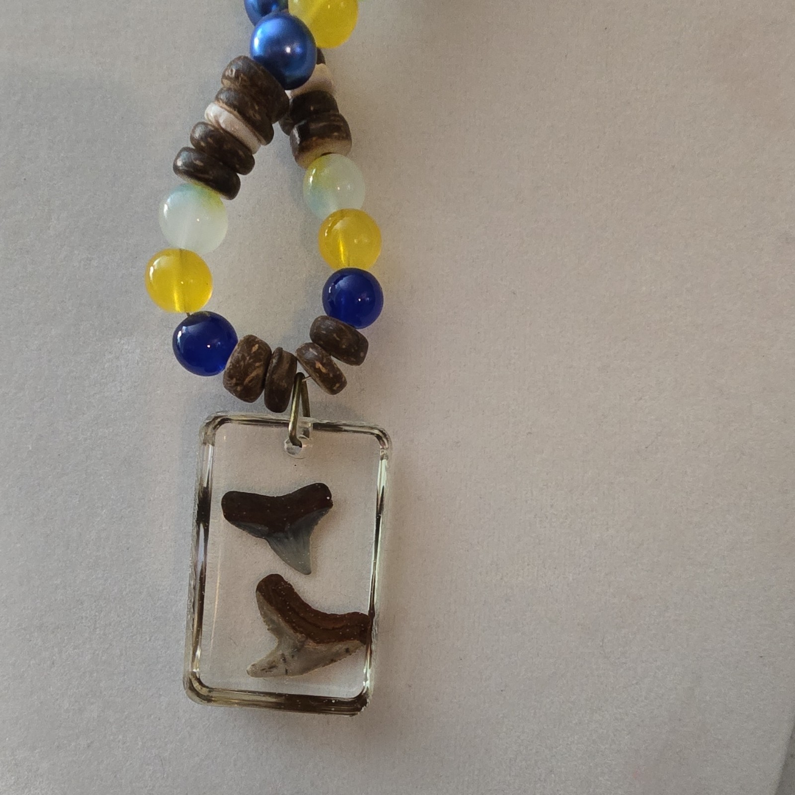 Beaded Necklace with Resin Shark Tooth Pendant, Glass And Coconut Shell Beads