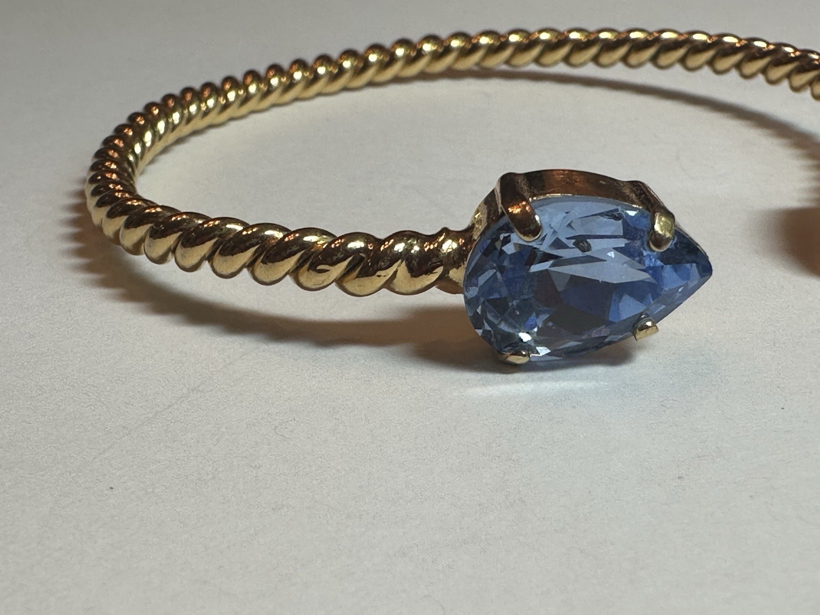 Caroline Svedbom Mini Drop Twisted Gold Tone Bracelet & Blue Swarovski Crystal