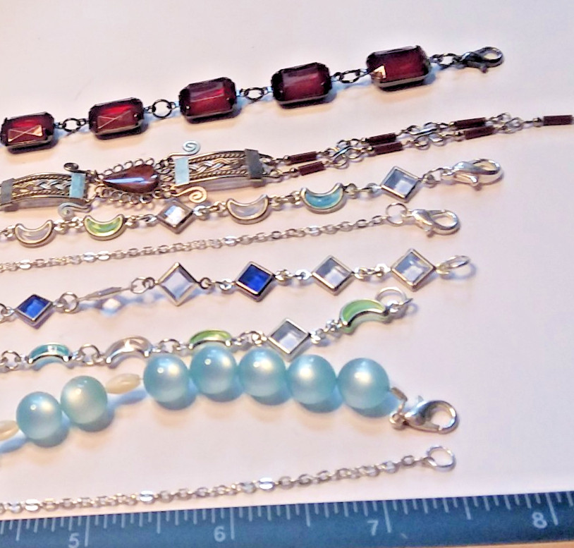 8 Bracelets: 3 Bracelets are Metal, 5 are Plastic 05-01-2026