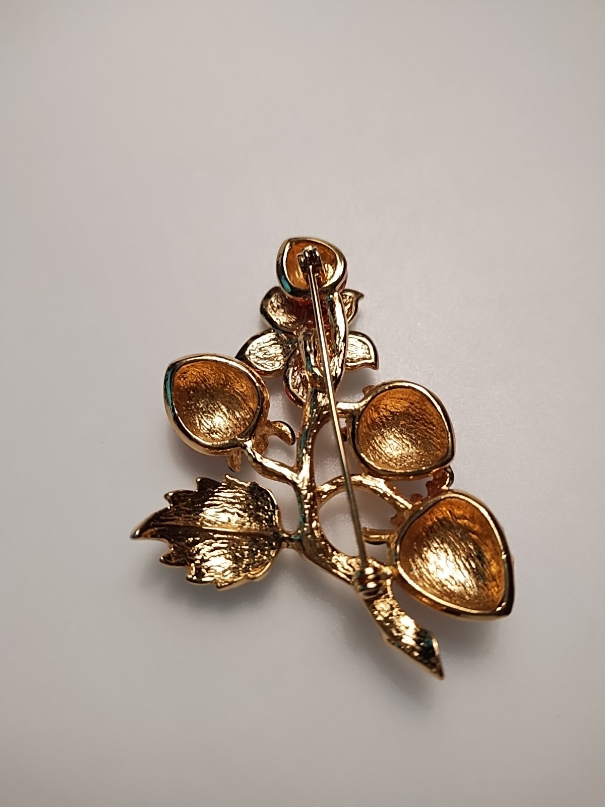 Gold Tone Strawberry broch with enamel strawberry and rhinestone Leafs 2 inch