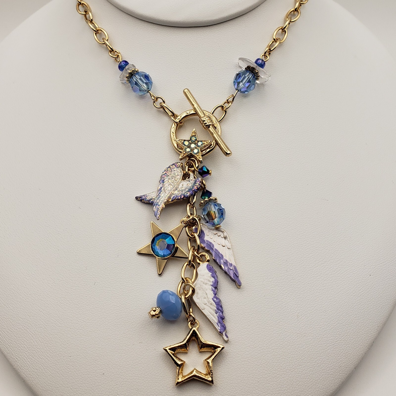 Kirks Folly Forever Angel Wings Charm Necklace Gold Tone 17in Long Blue Crystals
