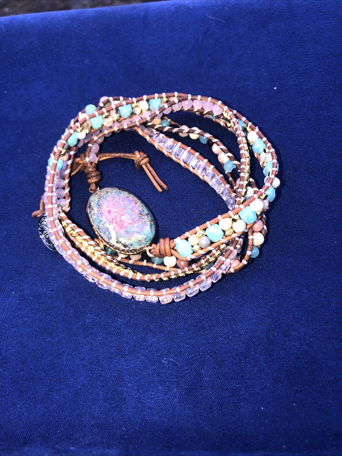A 37” long necklace ,￼￼ a Bohemian or Hippie emphasizing made of leather, gems.w