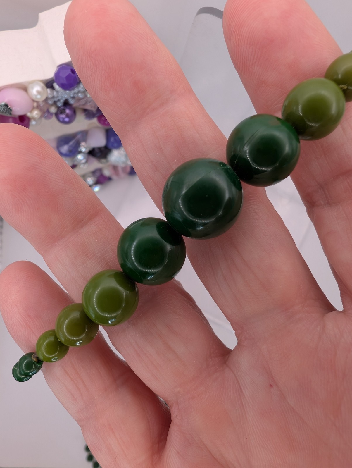 Long single strand green prominent graduated focal statement beaded necklace