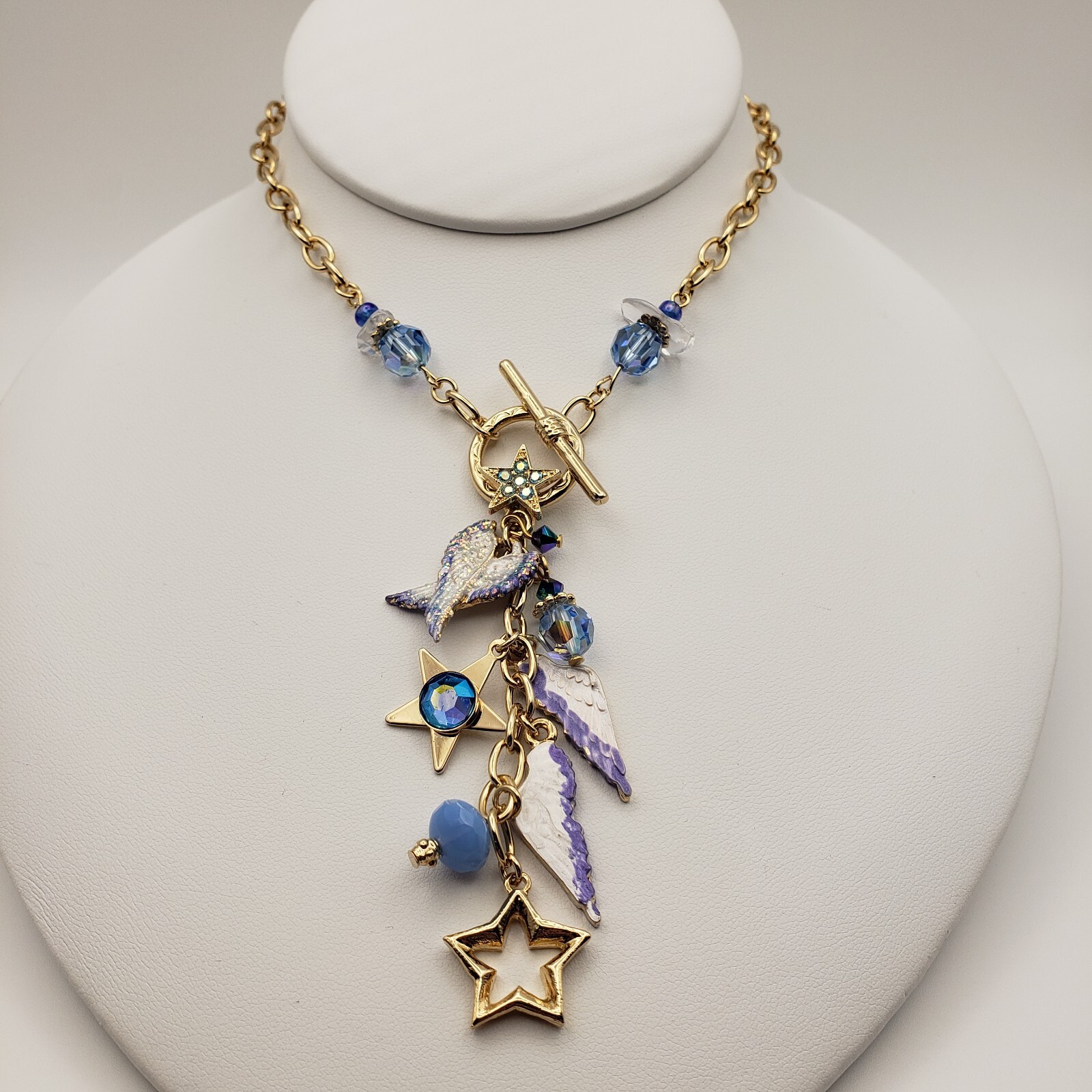 Kirks Folly Forever Angel Wings Charm Necklace Gold Tone 17in Long Blue Crystals