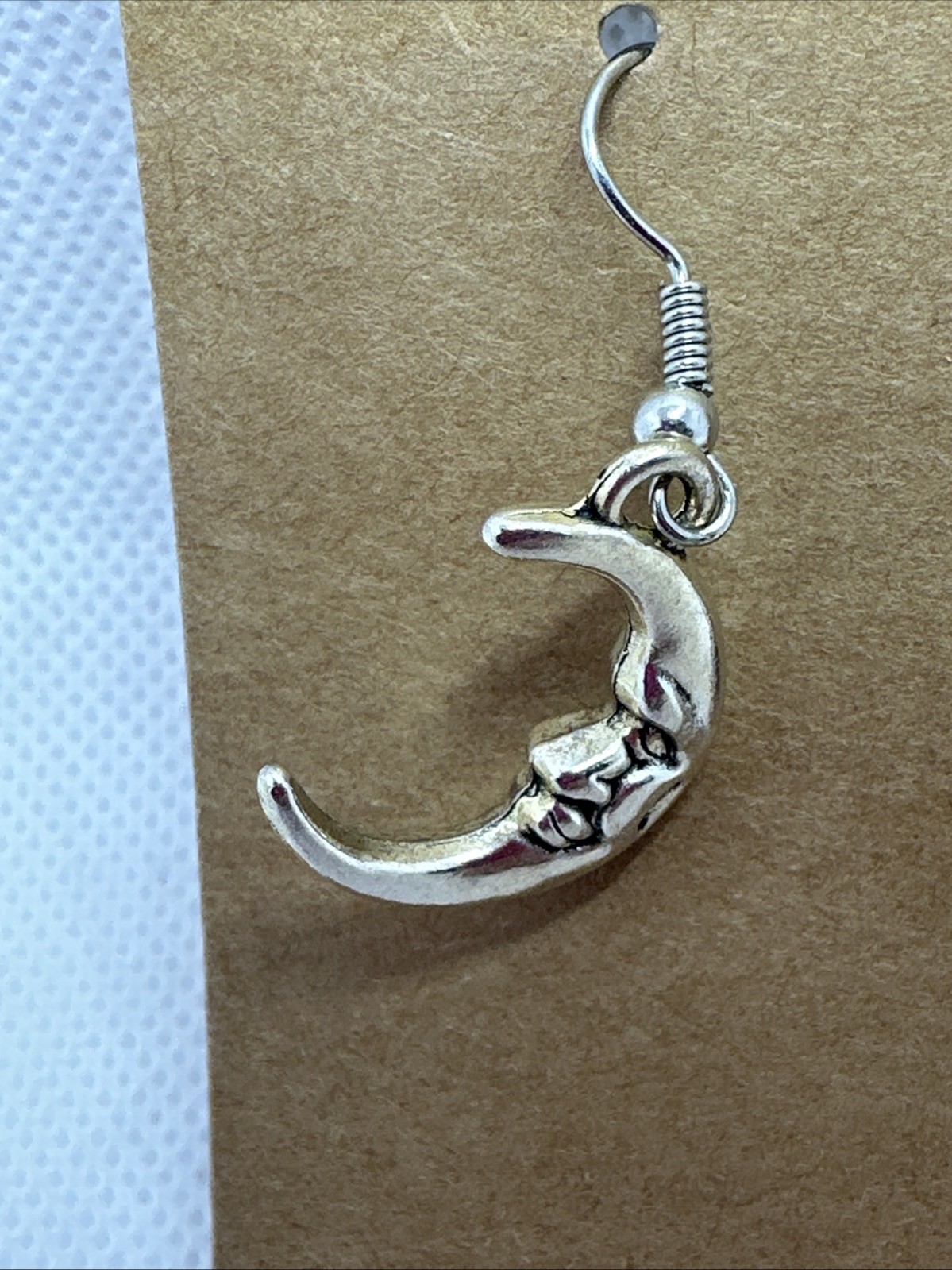 1″x1″ moon face dangling earrings