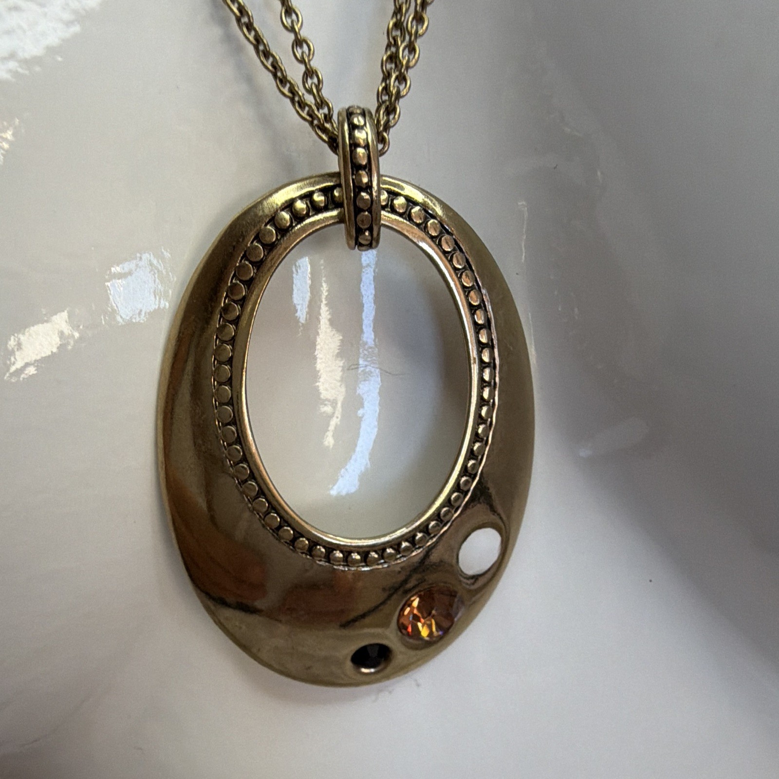 Lia Sophia Gold Tone Circle Pendant Necklace with Rhinestone Accents Long Chain