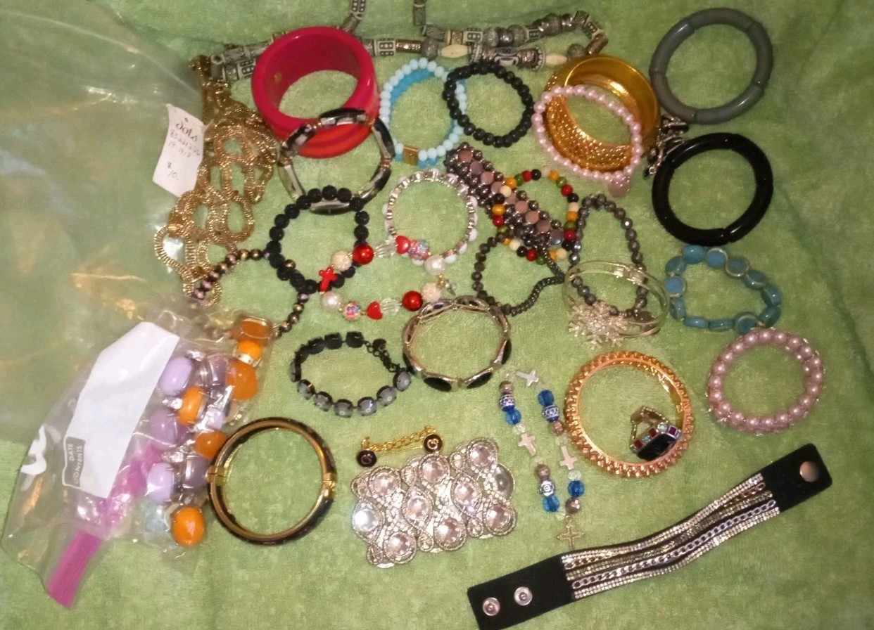 MULTIPLE FASHION BRACELETS MOST STRETCHY BUT SOME PRETTY ONES, SOME SIGNED BRASS