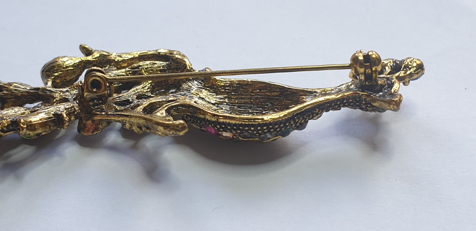 Peacock Brooch. Gold tone with Multicoloured glass beads . 84mm x 28mm.
