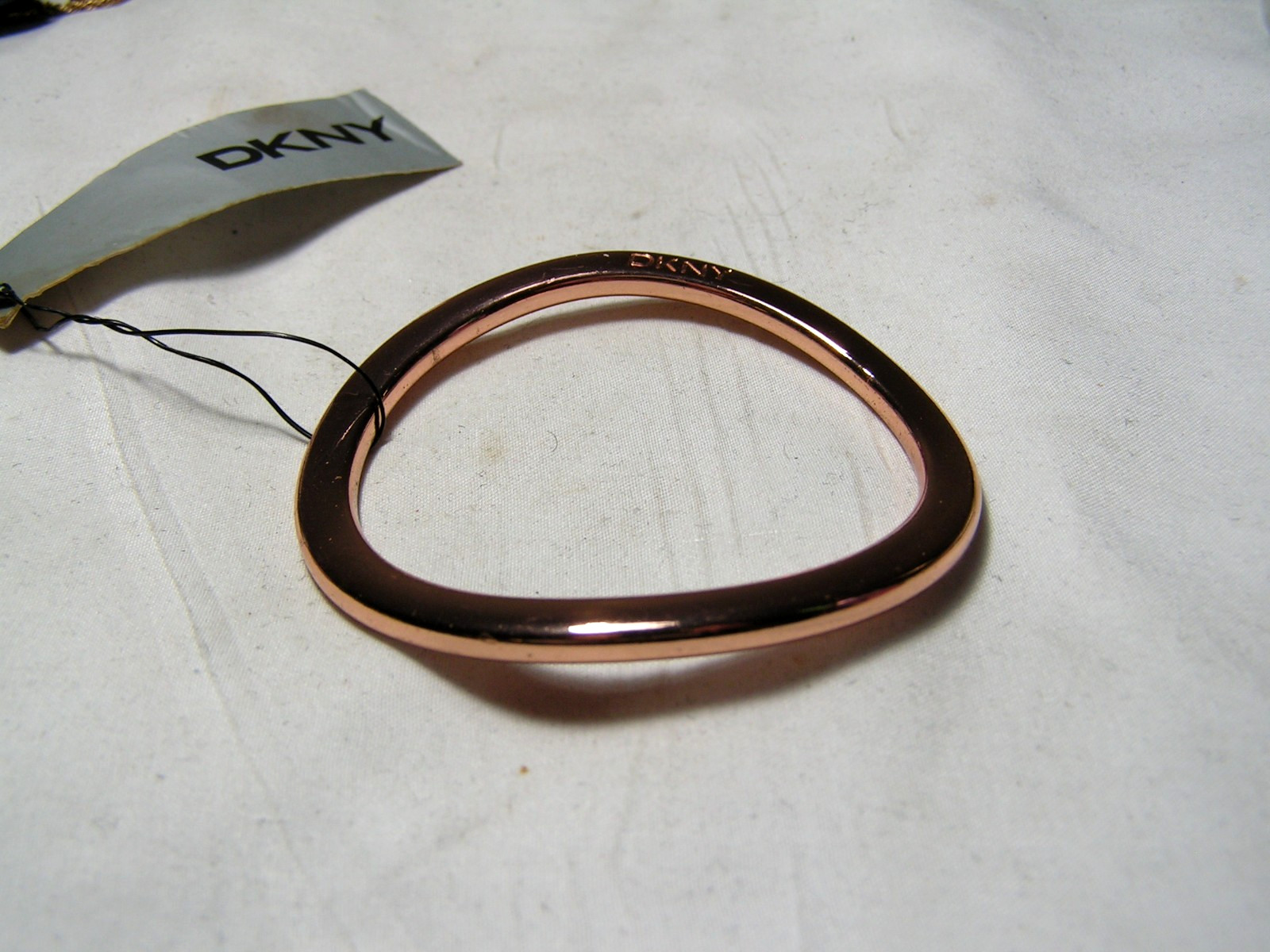 …DKNY Donna Karan…Rose Gold Tone Wavy Design Bangle Bracelet…Small Size…