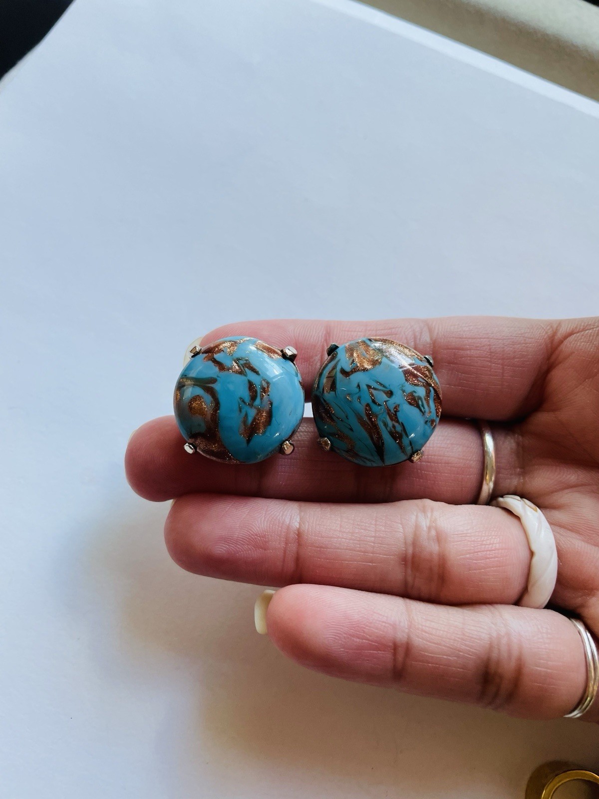 Vintage Crown Trifari round clip-on earrings, featuring turquoise cabochon