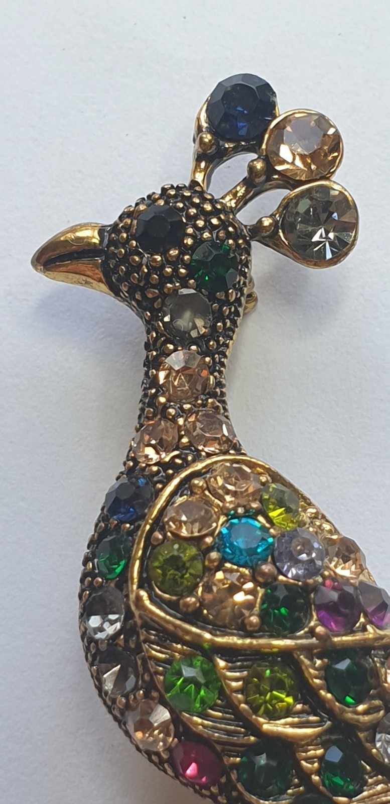 Peacock Brooch. Gold tone with Multicoloured glass beads . 84mm x 28mm.