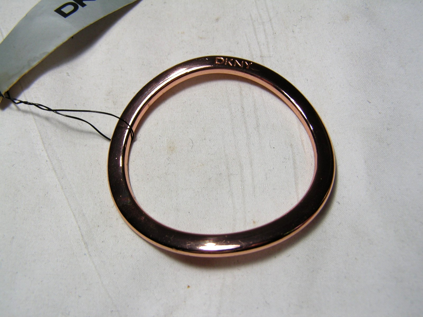 …DKNY Donna Karan…Rose Gold Tone Wavy Design Bangle Bracelet…Small Size…