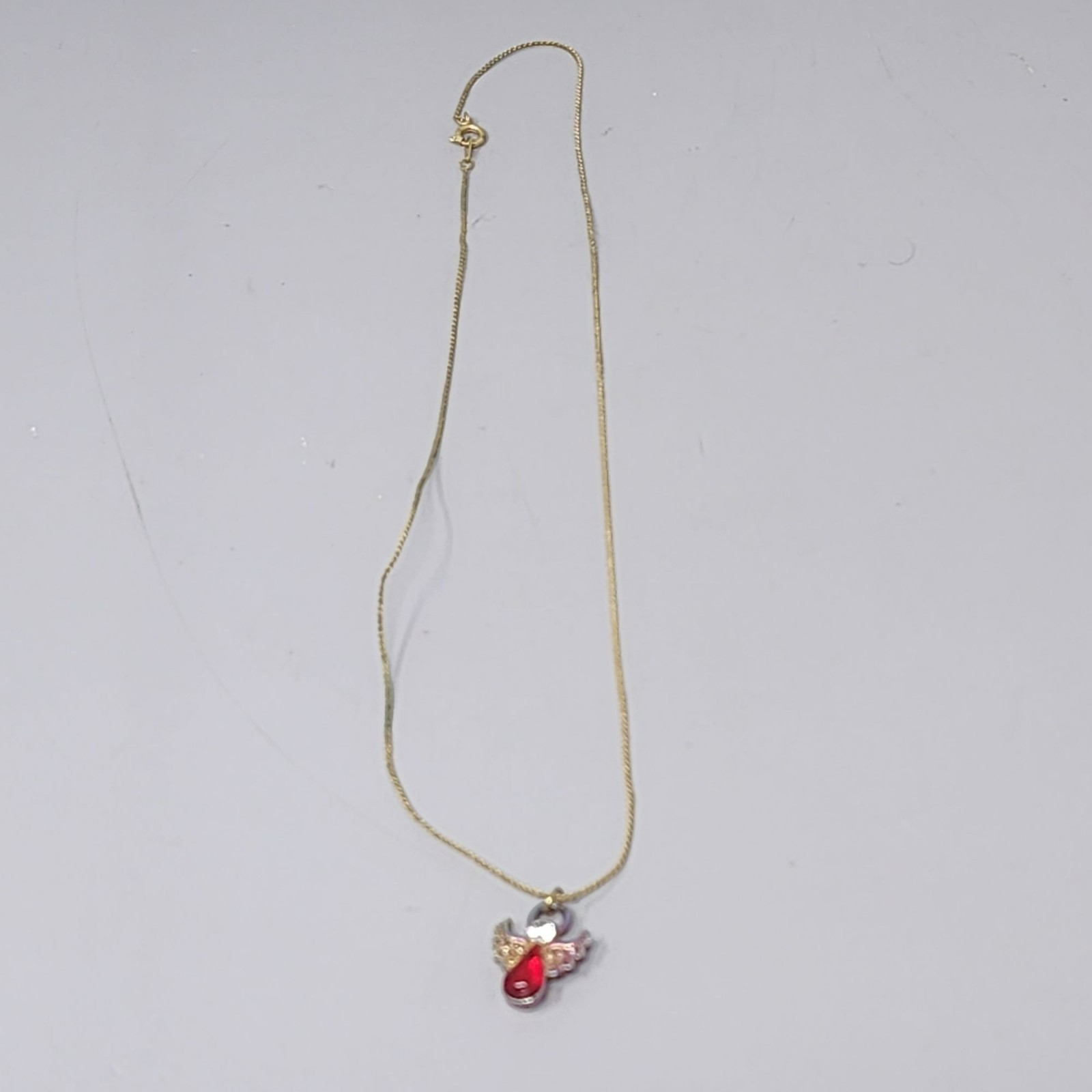 Gold Angel Pendant Necklace With Red Gemstone & Crystal Accents