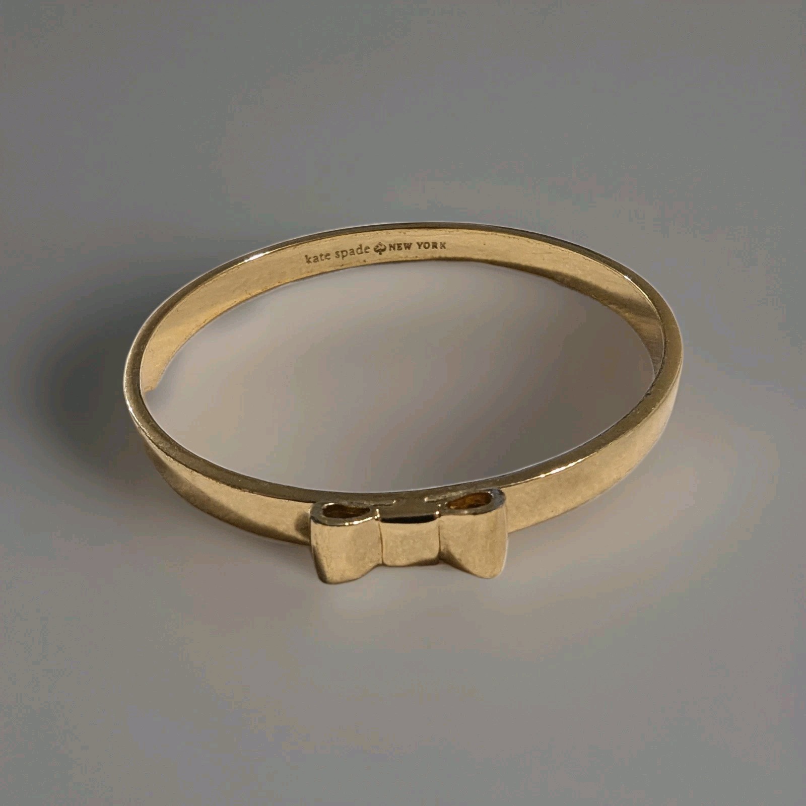 Kate Spade Small Bow Bangle Gold Tone 7.5” Slip-On Minimalist Stack Bracelet