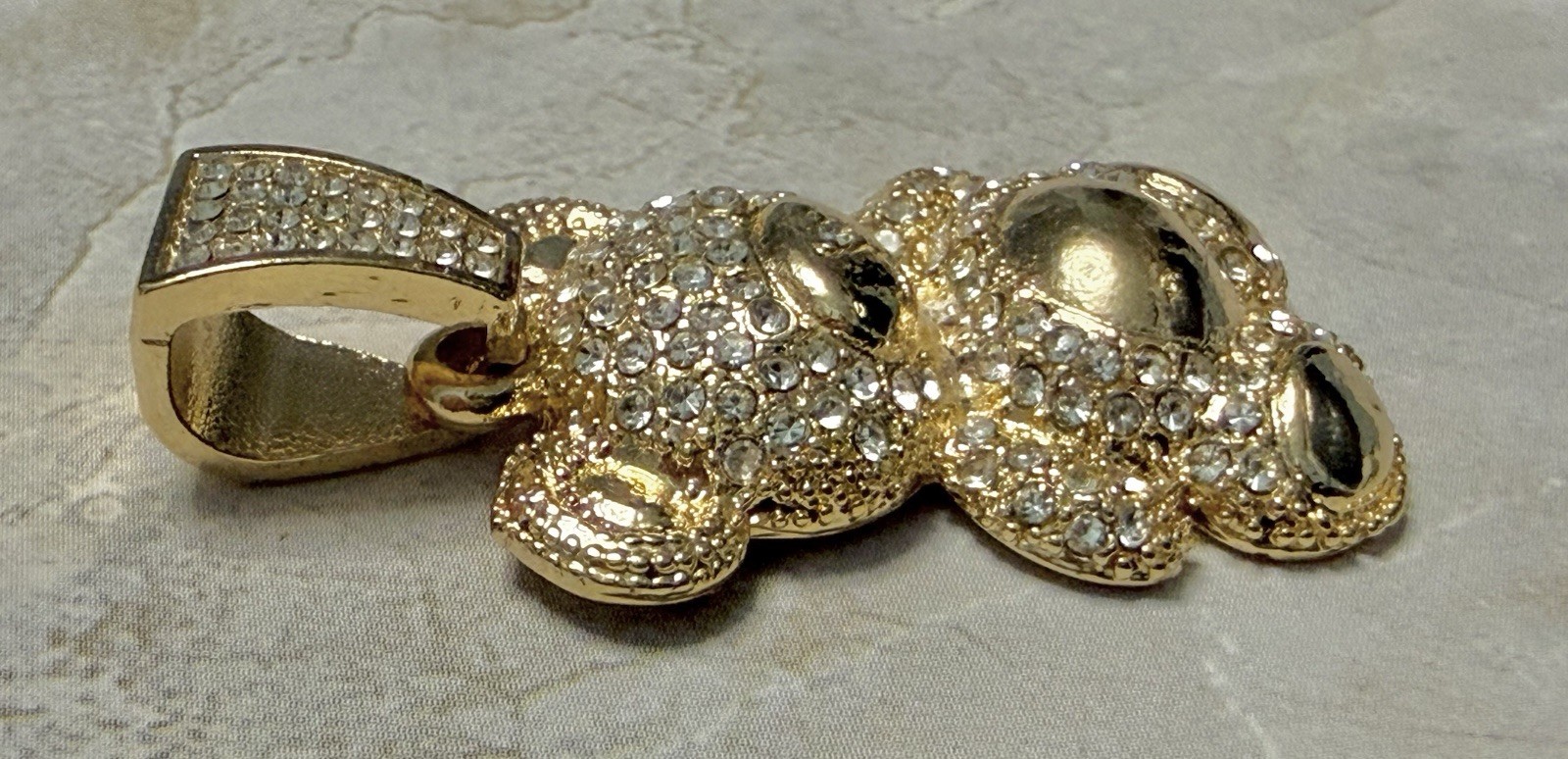 Gold Tone Teddy Bear Charm Covered In Sparkling Diamond Simulants.