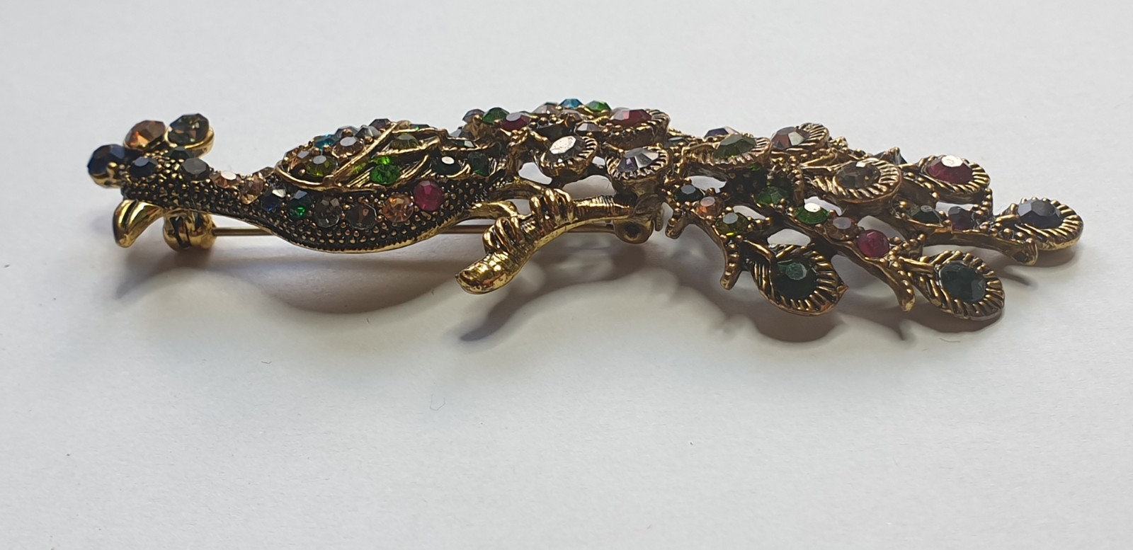 Peacock Brooch. Gold tone with Multicoloured glass beads . 84mm x 28mm.