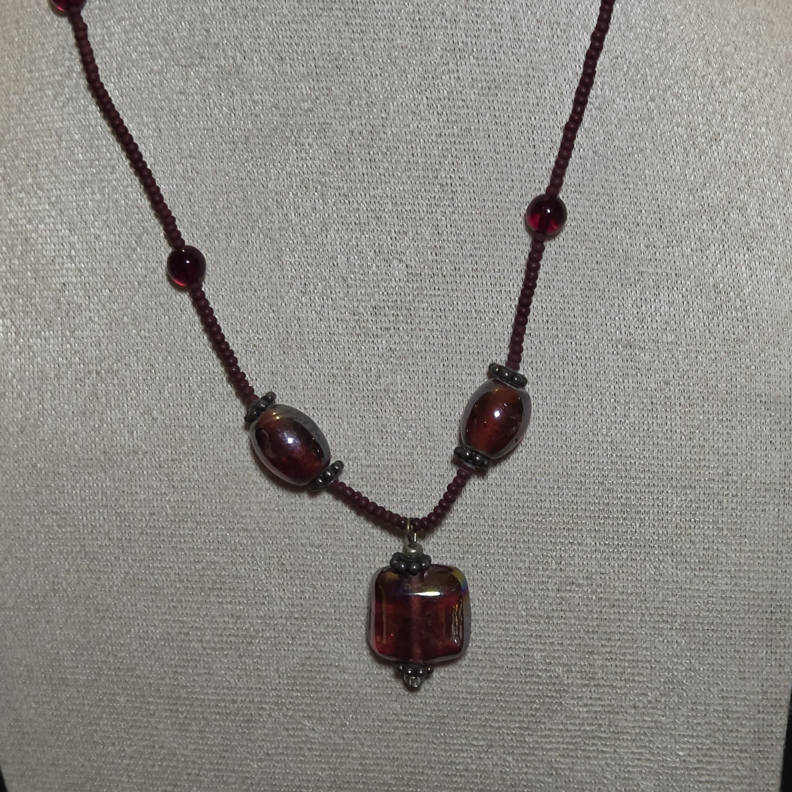 Burgundy Glass Beaded Necklace With Pendant.
