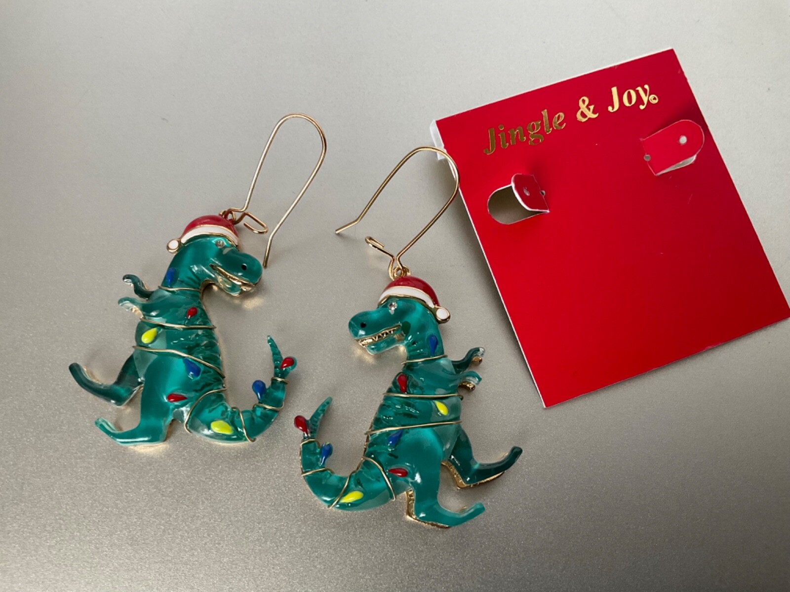 T-Rex Christmas Dinosaur Earrings Wearing Christmas Lights & Santa Hat