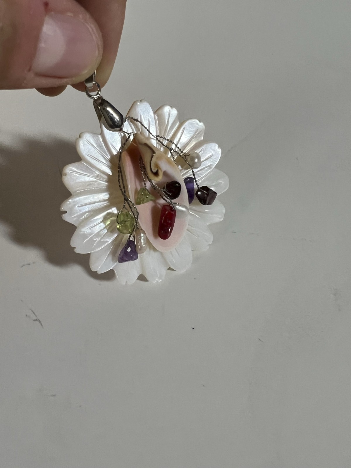 Handcarved Mother of Pearl Shell Floral Pendant. No maker mark found.