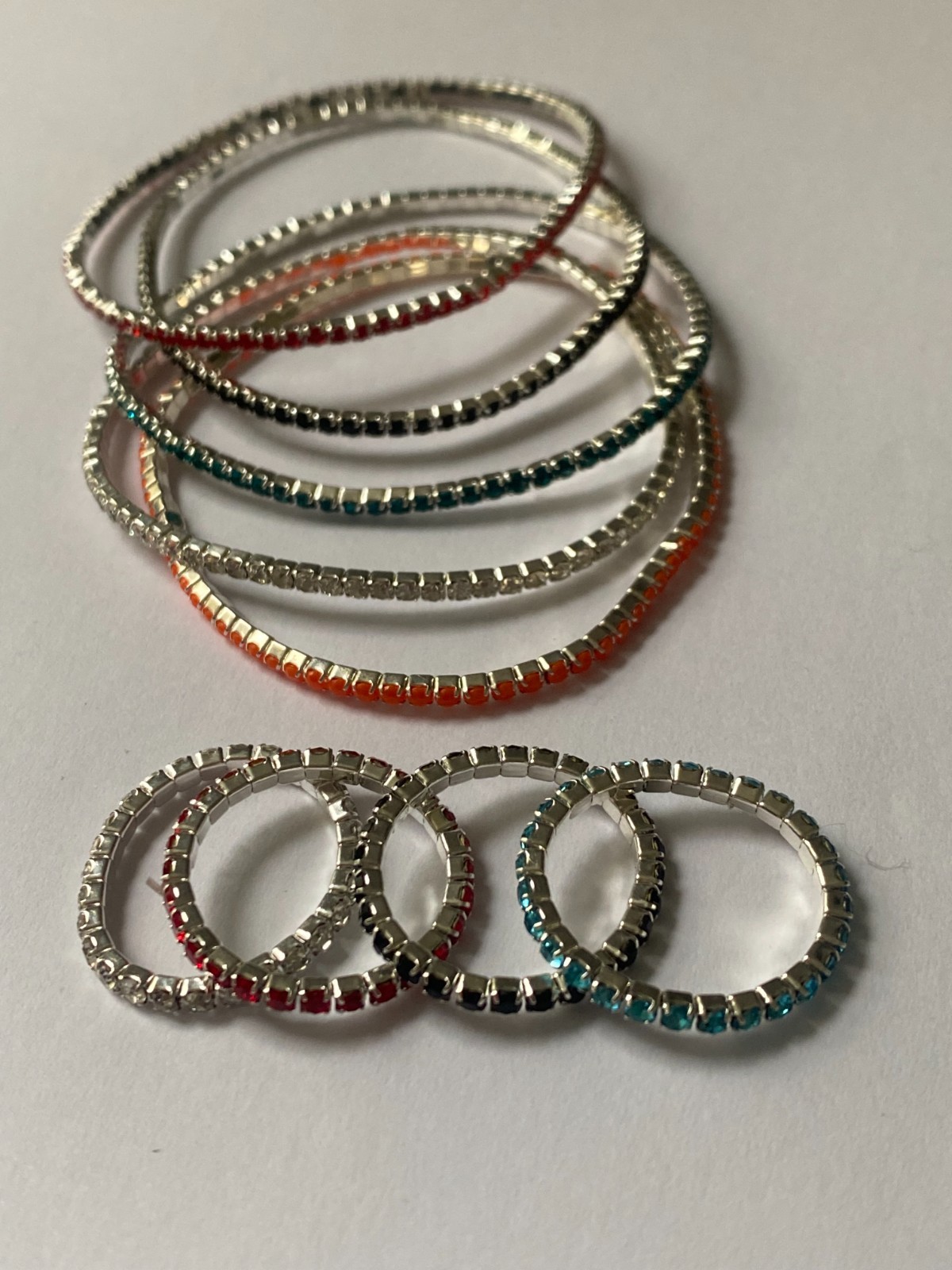 5 stretchy bracelets and 4 stretchy rings, shiny and new