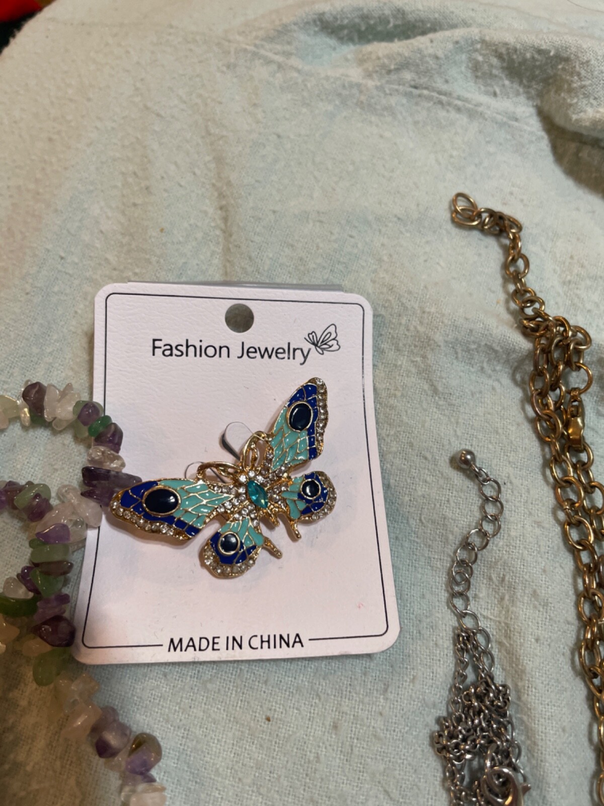 set amethyst necklace with enamel butterfly gold tone broch and 2 necklaces wit