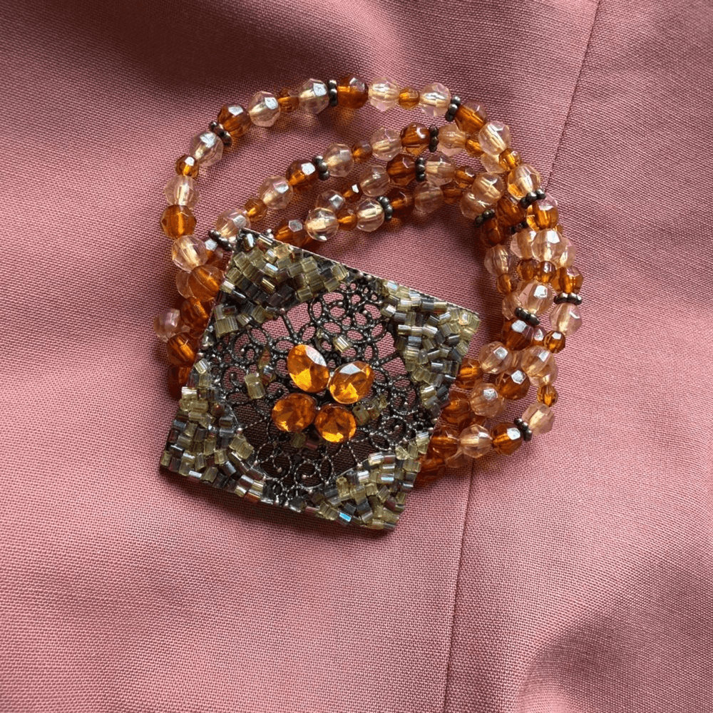 Y2K Multi-stranded Bracelet with a faux Amber Glass, Gems Statement Pendant