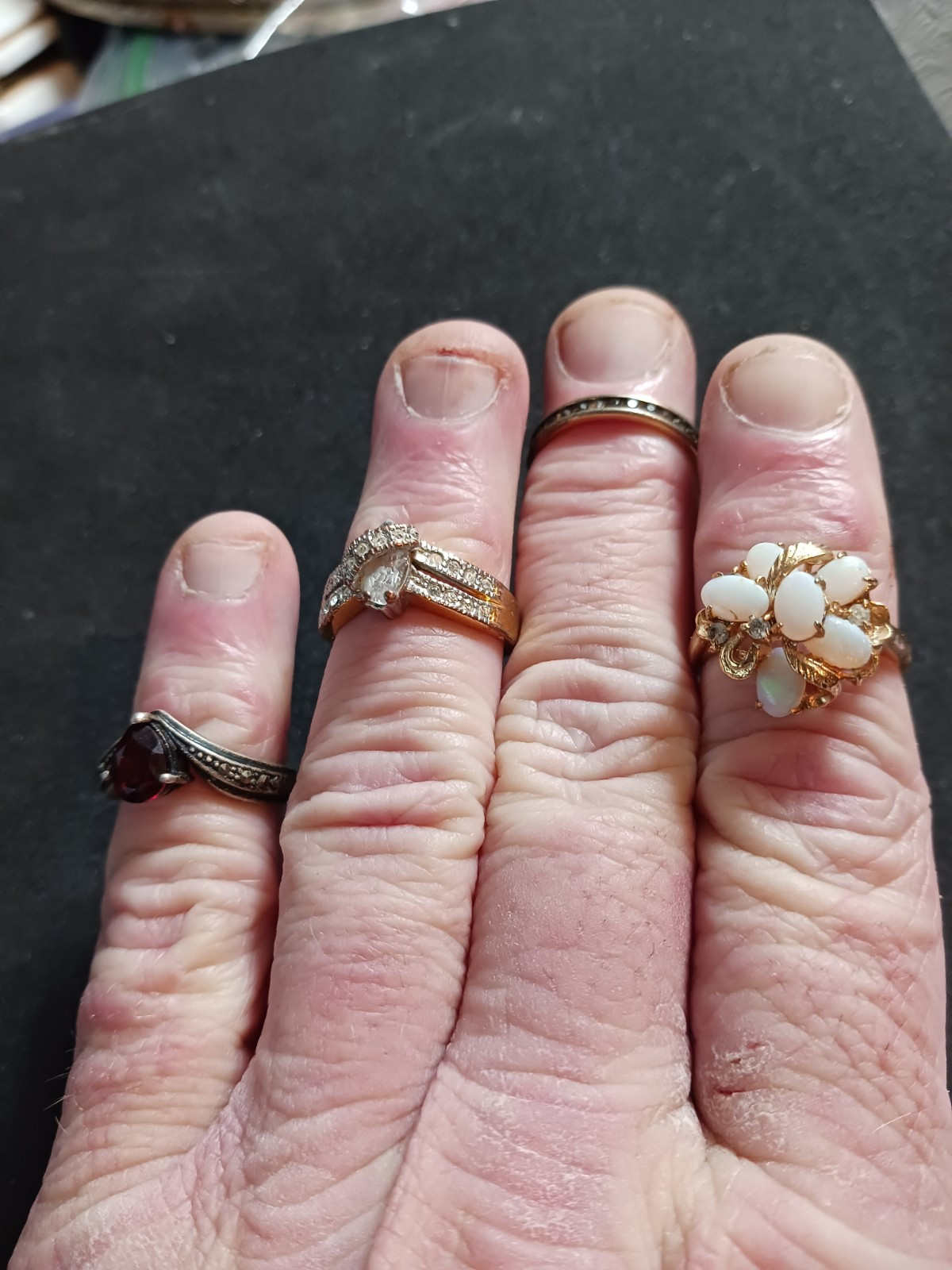 4 Beautiful Rings 3 with no markings 1 stamped M with a Trademark Nice