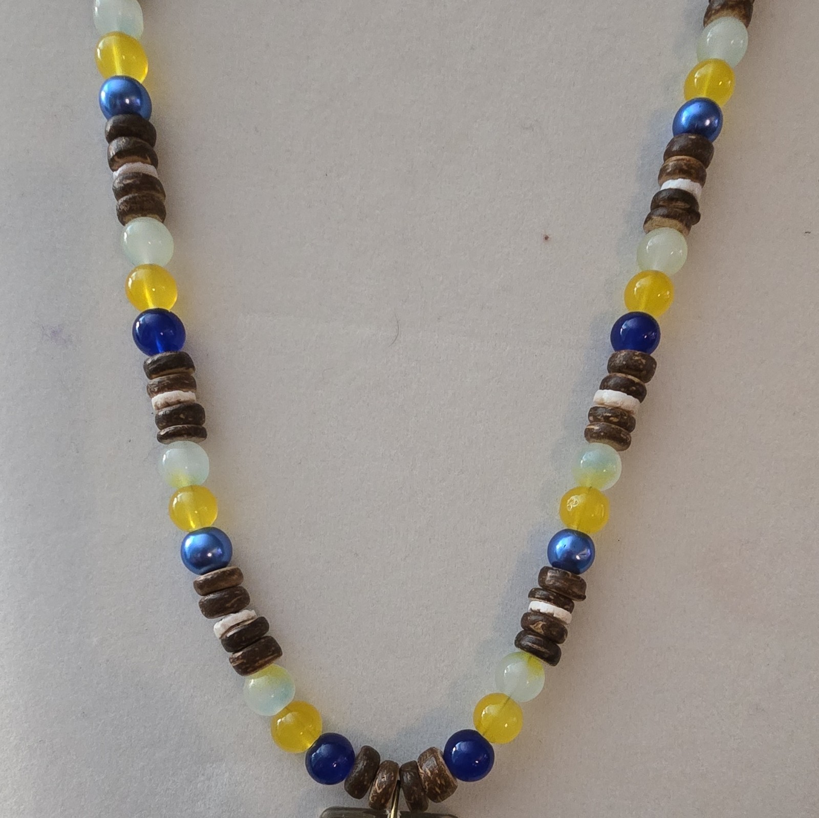 Beaded Necklace with Resin Shark Tooth Pendant, Glass And Coconut Shell Beads