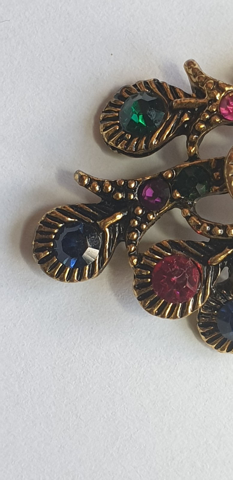 Peacock Brooch. Gold tone with Multicoloured glass beads . 84mm x 28mm.