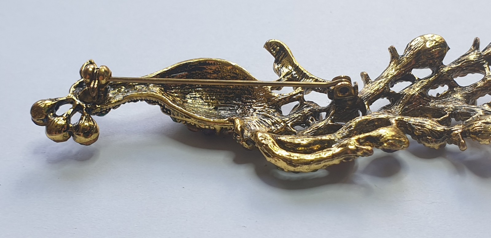 Peacock Brooch. Gold tone with Multicoloured glass beads . 84mm x 28mm.