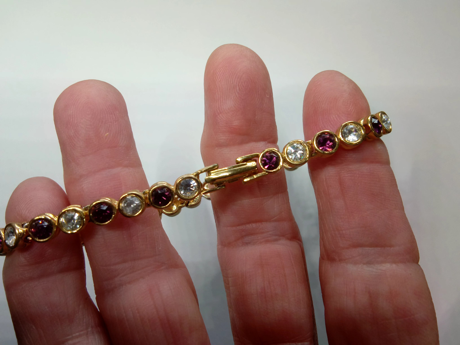 Gold Tone Tennis Bracelet with Alternating Clear and Purple Rhinestoness