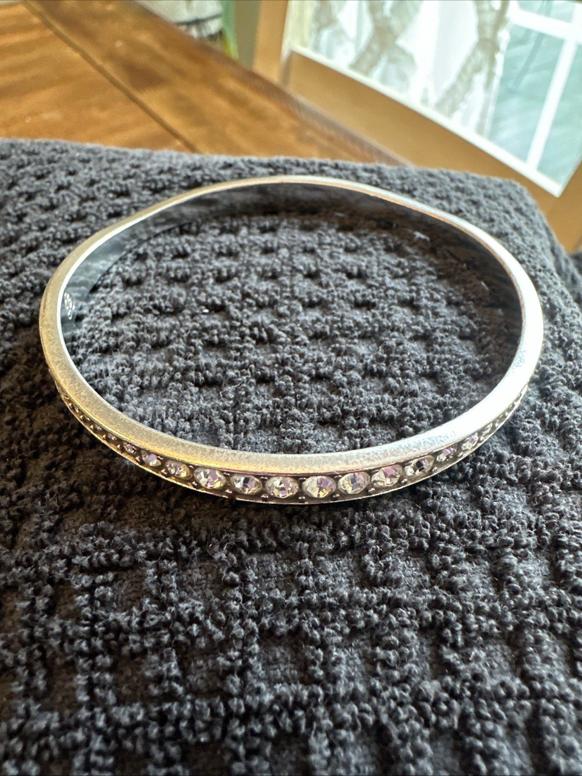 Brighton “Light Hearted” Bangle sparkling, varied-size crystal rhinestones.