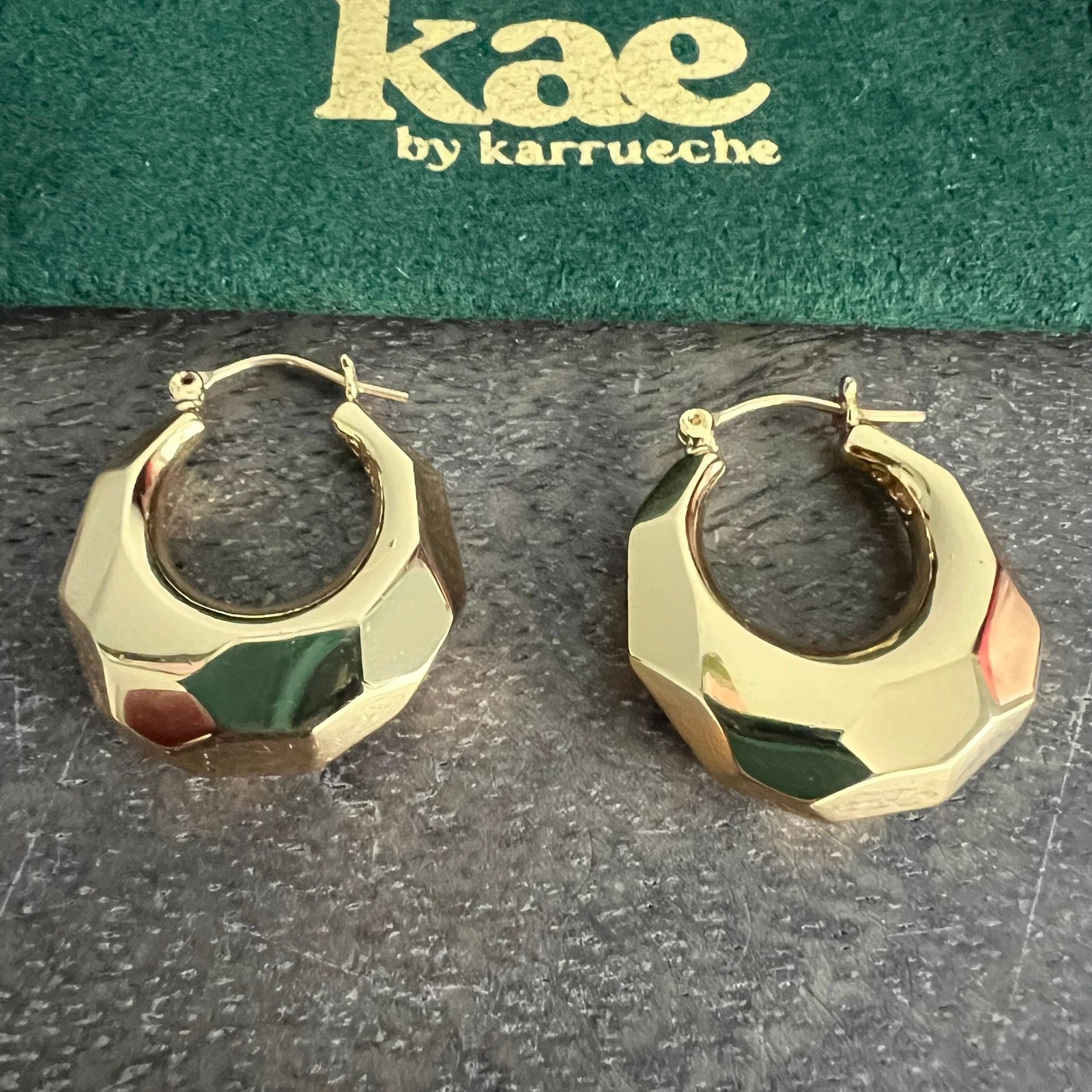 Kae by Karrueche signed gold tone chunky hoop earrings with branded pouch