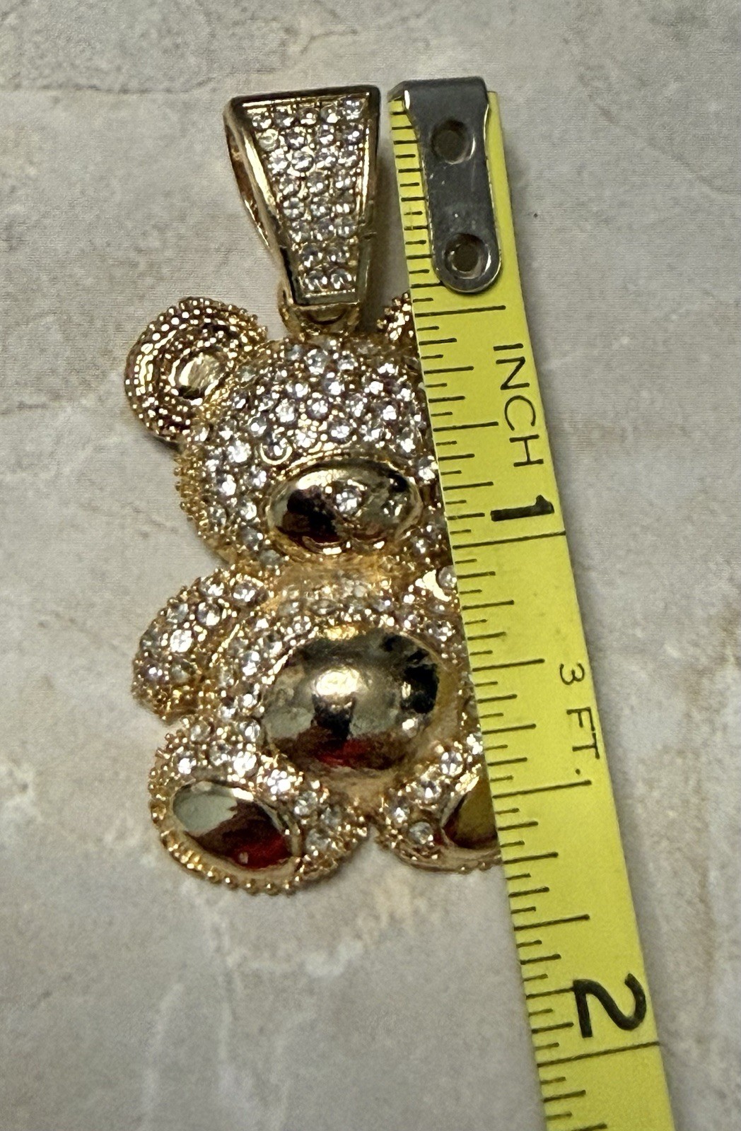 Gold Tone Teddy Bear Charm Covered In Sparkling Diamond Simulants.