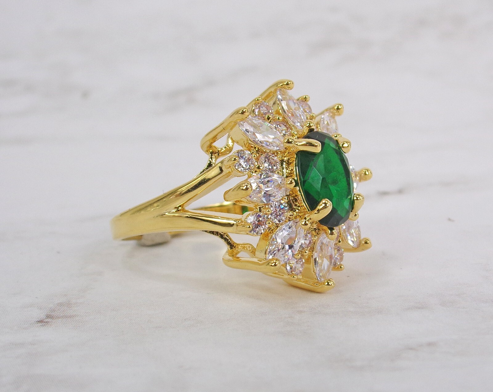 Large green oval cubic zirconia stone ring with clear marquise round CZ stones