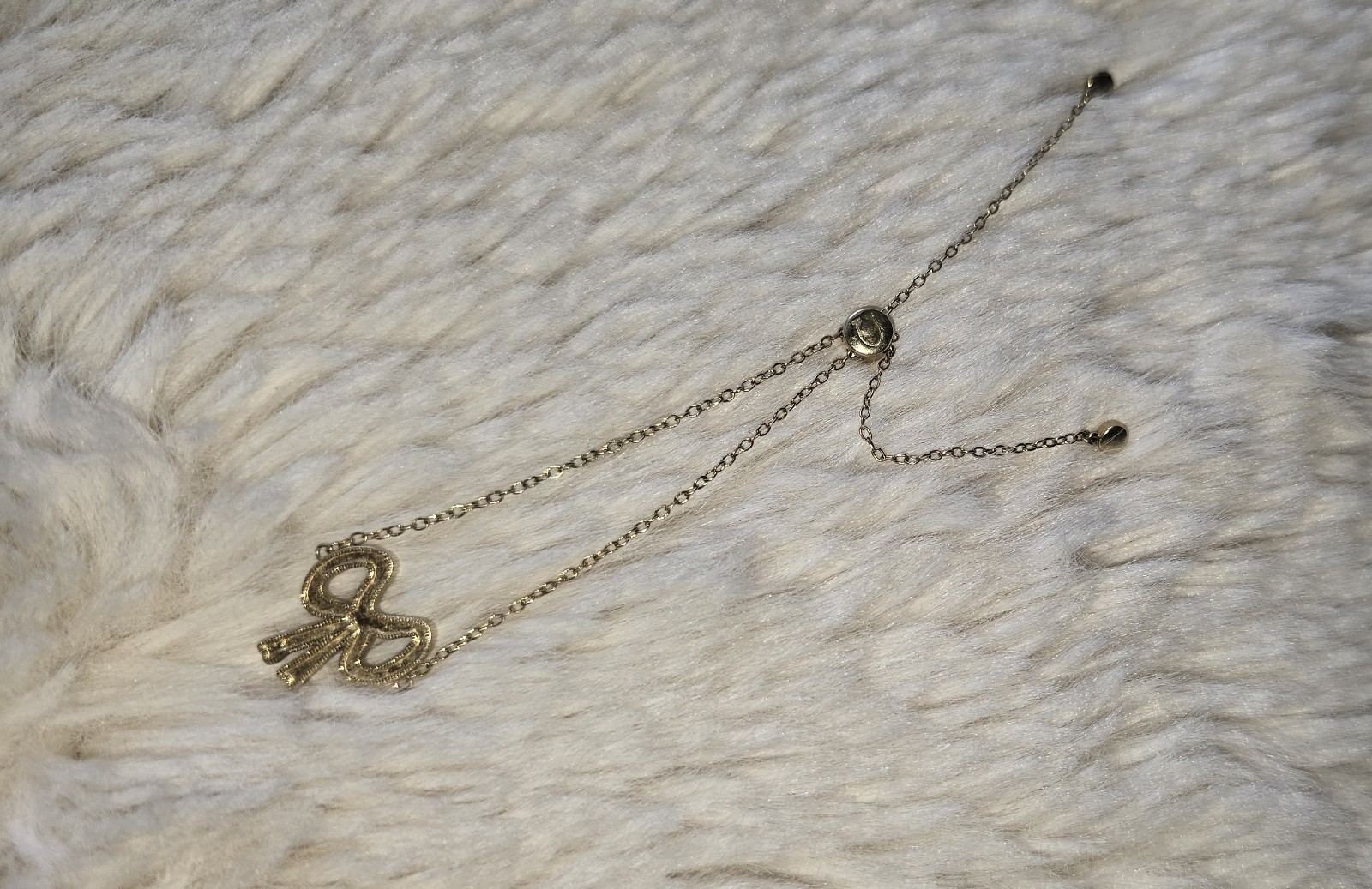Coach New York Pave Bow Slider Bracelet Gold toned Clear Crystals
