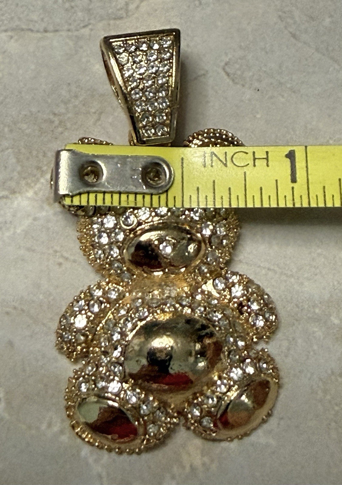 Gold Tone Teddy Bear Charm Covered In Sparkling Diamond Simulants.