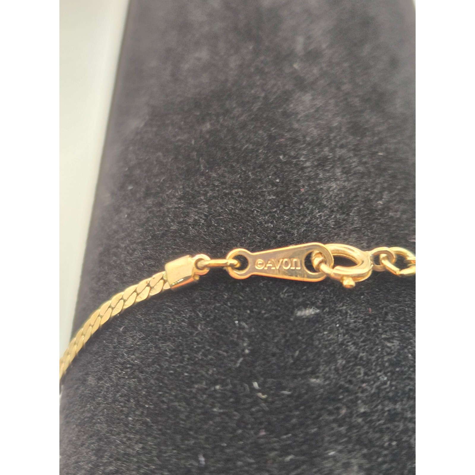 Avon Gold Tone Chain Bracelet with Single Rhinestone Plate.