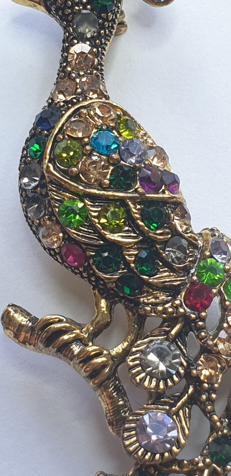 Peacock Brooch. Gold tone with Multicoloured glass beads . 84mm x 28mm.